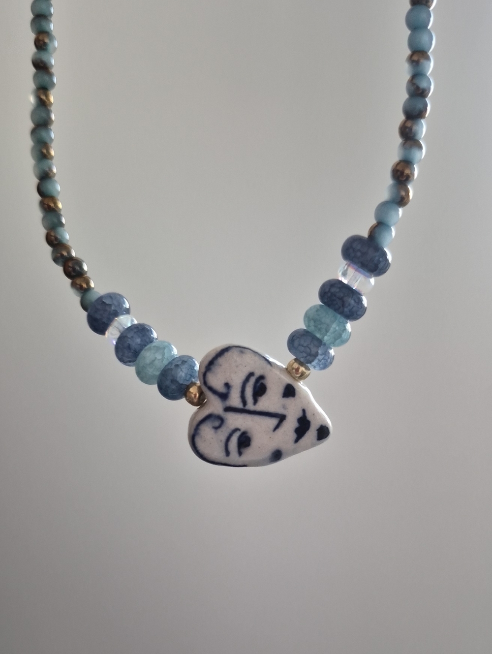 Blue Beaded Necklace with Ceramic Heart Face Pendant